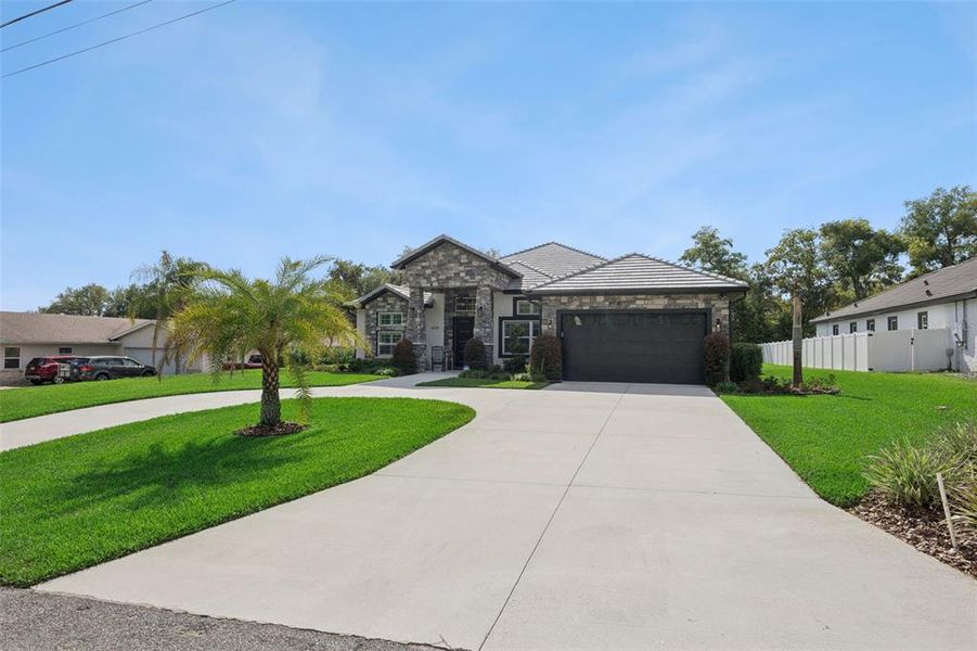Front exterior of a new home in , Clermont, FL, highlighting curb appeal (Image 20).