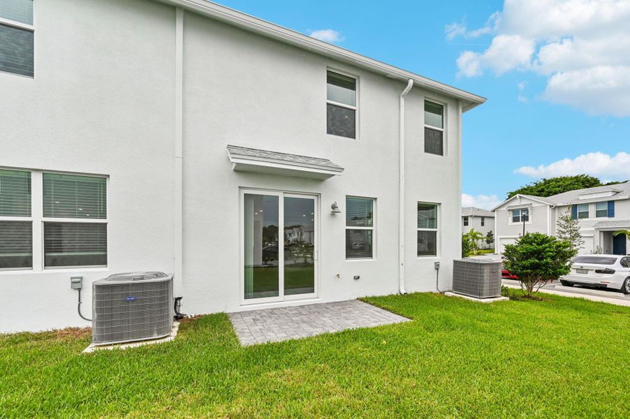 Front exterior of a new home in Tidewater, Fort Pierce, FL, highlighting curb appeal (Image 15). Front exterior of a new home in Tidewater, Fort Pierce, FL, highlighting curb appeal (Image 15).