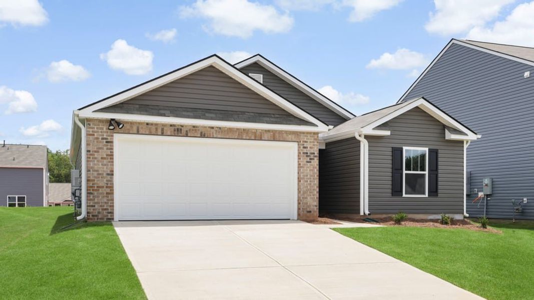 Front exterior of a new home in Cedar Gap, Fountain Inn, SC, highlighting curb appeal (Image 2). Front exterior of a new home in Cedar Gap, Fountain Inn, SC, highlighting curb appeal (Image 2).