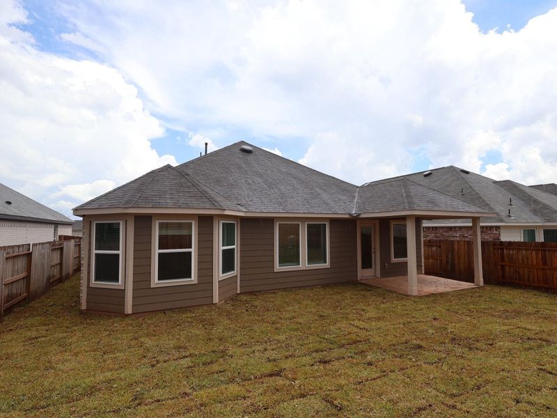 Exterior details and patio area of a home in Magnolia Ridge, Magnolia (Image 4).