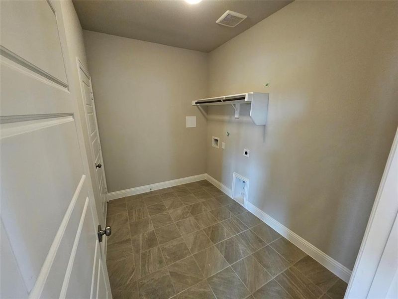 Oversized laundry room with lots of storage space