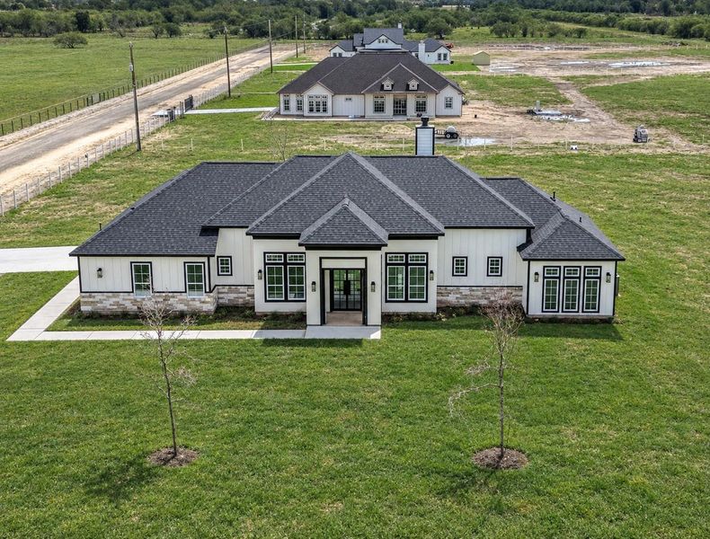 Beautiful front view of the home, highlighting the stone accents, modern details, and welcoming exterior. Beautiful front view of the home, highlighting the stone accents, modern details, and welcoming exterior.