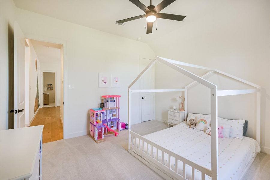 Fourth Bedroom with carpet and view of the game room.