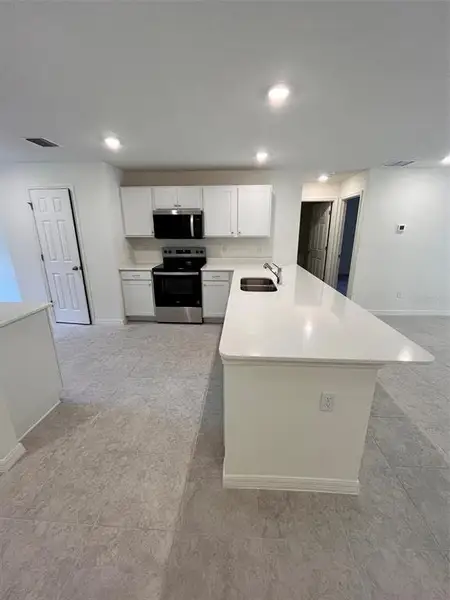 Furnished interior view inside a new home in Flagler Estates, Hastings (Image 3).