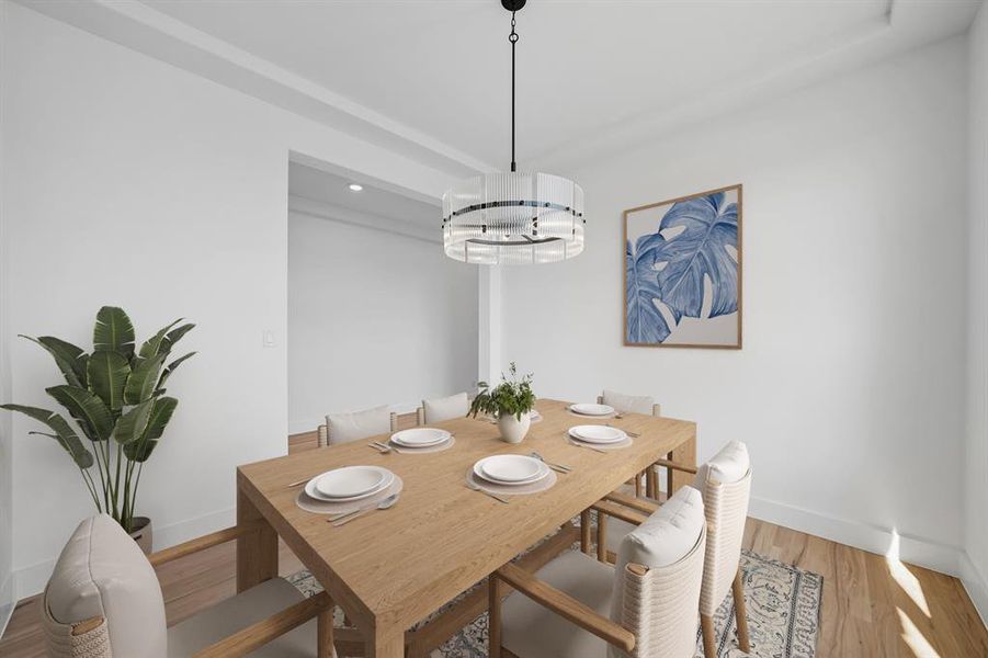 Dining area with wood finished floors and recessed lighting