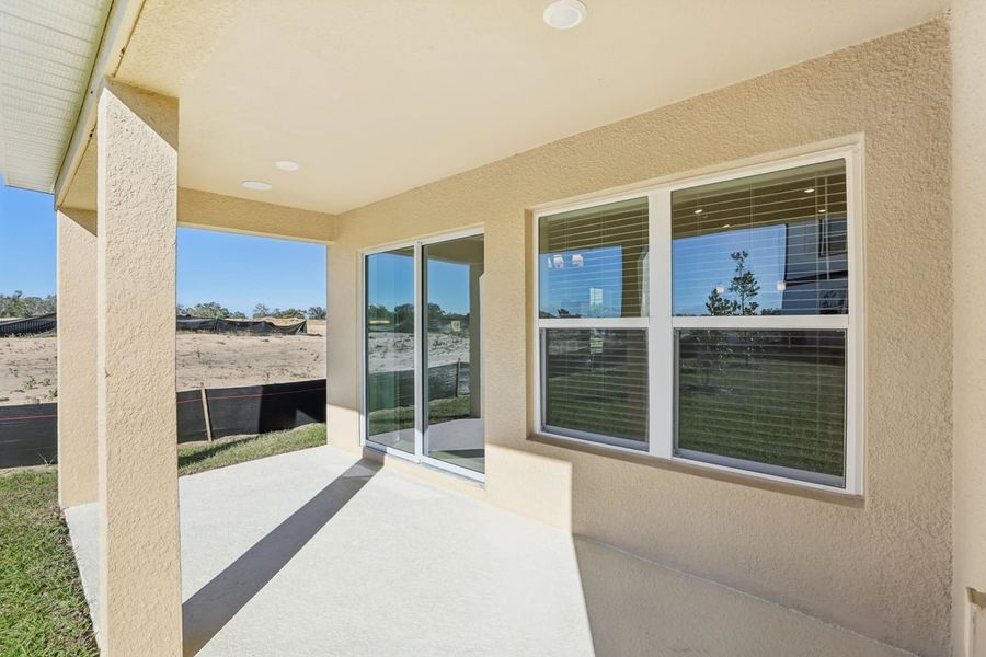 Exterior details and patio area of a home in Robins Run, Lake Wales (Image 3).