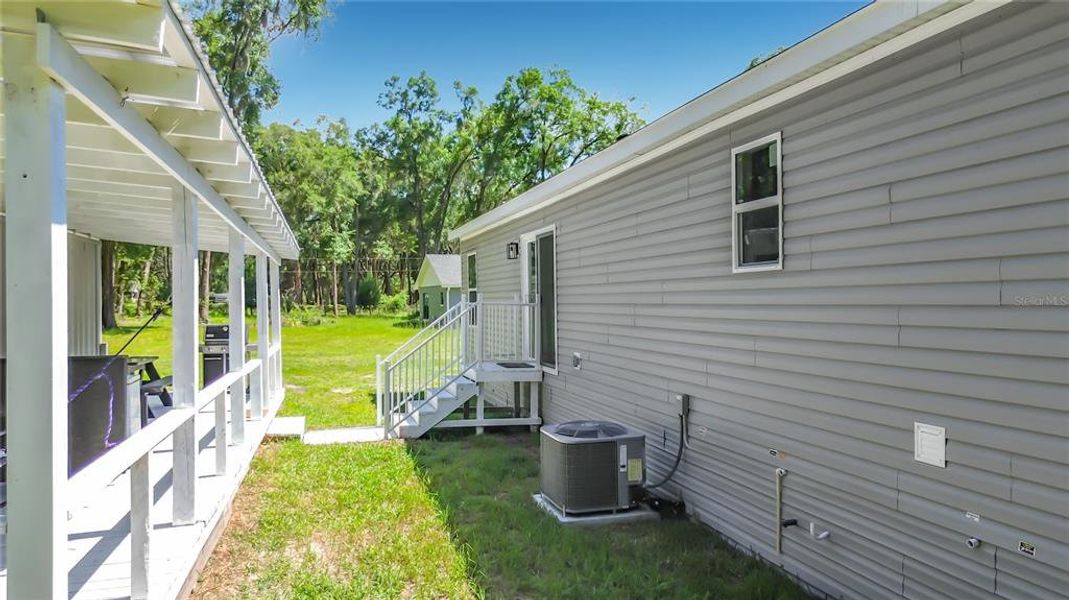 Exterior details and patio area of a home in , Summerfield (Image 33).