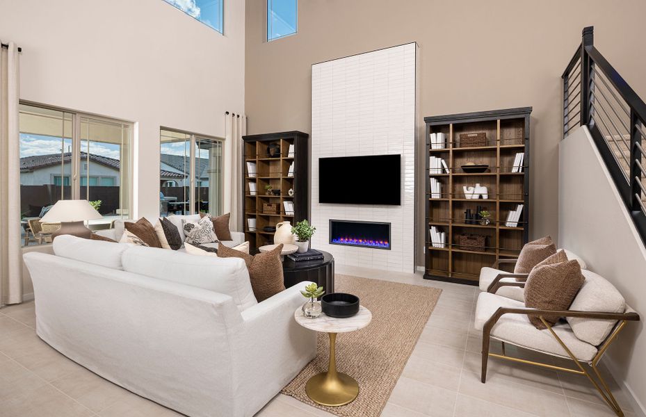 Open gathering room with stone fireplace in Prato new home at Jorde Farms in Queen Creek, AZ Open gathering room with stone fireplace in Prato new home at Jorde Farms in Queen Creek, AZ