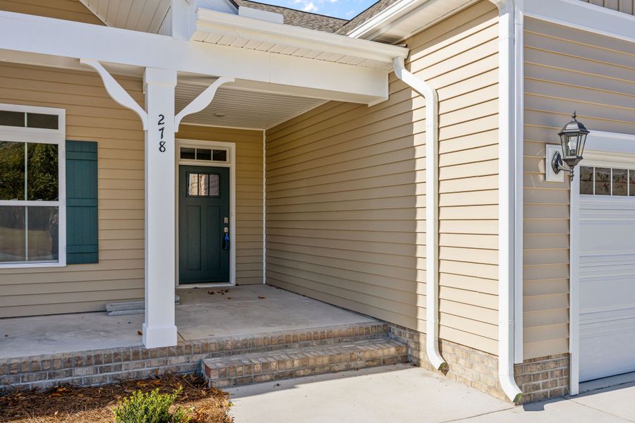 Exterior details and patio area of a home in Kennedy's Crossing, Grimesland (Image 24).
