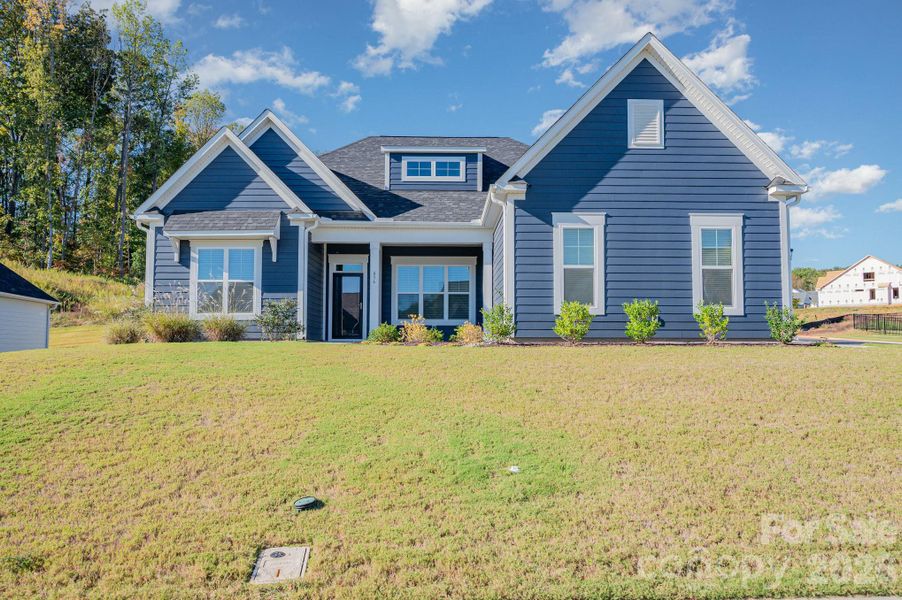 Front exterior of a new home in Red Hill, Concord, NC, highlighting curb appeal (Image 21). Front exterior of a new home in Red Hill, Concord, NC, highlighting curb appeal (Image 21).