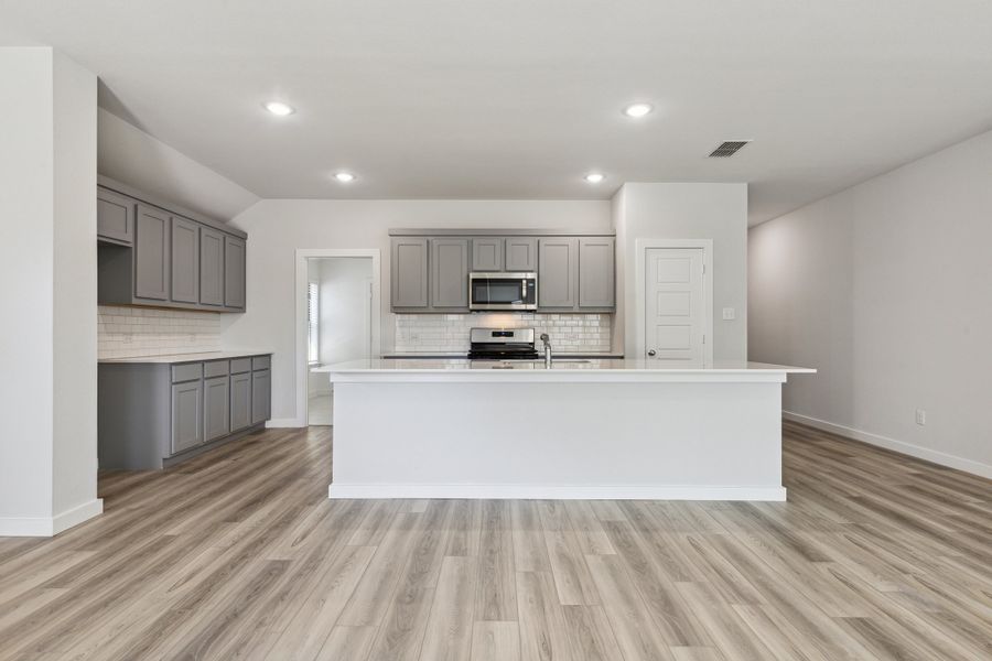 Kitchen in the Heisman home plan by Trophy Signature Homes – REPRESENTATIVE PHOTO