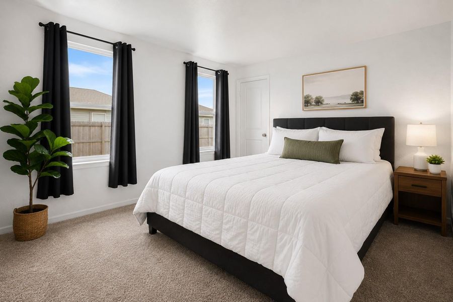 A well-lit bedroom provides a serene escape, featuring neutral tones and a cozy ambiance.