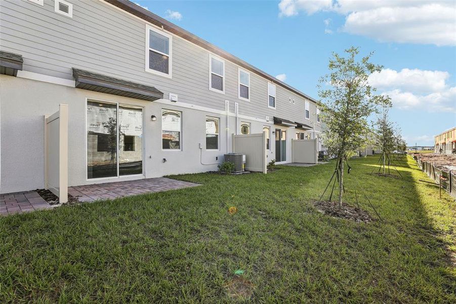 Exterior details and patio area of a home in The Meadow at Crossprairie Bungalows, St. Cloud (Image 34).