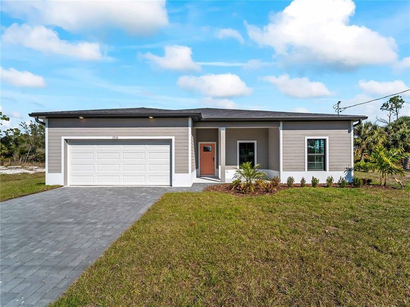 Front exterior of a new home in , North Port, FL, highlighting curb appeal (Image 26).