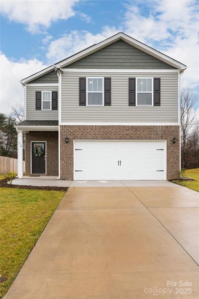 Front exterior of a new home in , Arden, NC, highlighting curb appeal (Image 23). Front exterior of a new home in , Arden, NC, highlighting curb appeal (Image 23).