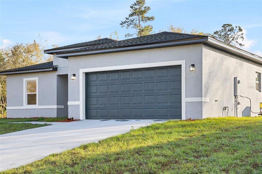 Front exterior of a new home in , Ocala, FL, highlighting curb appeal (Image 2). Front exterior of a new home in , Ocala, FL, highlighting curb appeal (Image 2).