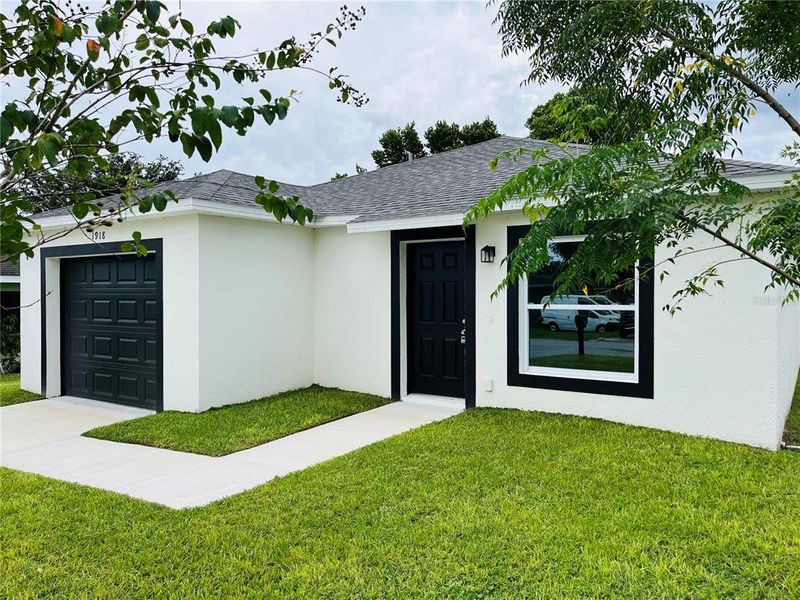 Front exterior of a new home in , Haines City, FL, highlighting curb appeal (Image 7). Front exterior of a new home in , Haines City, FL, highlighting curb appeal (Image 7).