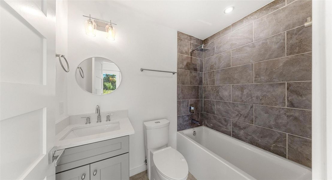 A spa-like bath with a tiled walk-in shower — a calm place to start the morning or rinse away a long day. Model No. 104 Shown.