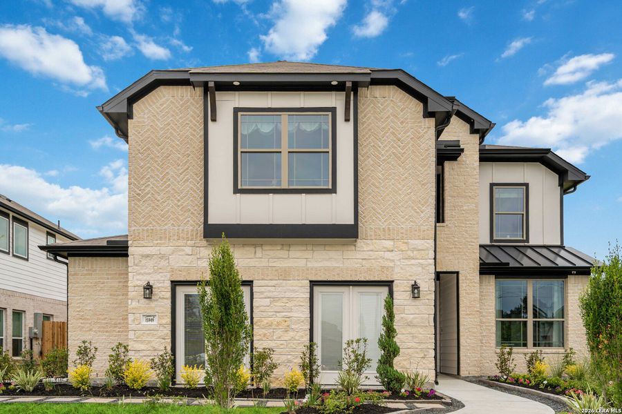 Front exterior of a new home in Hunters Ranch, San Antonio, TX, highlighting curb appeal (Image 6).