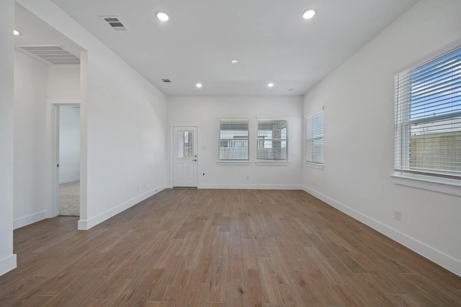 Representative unfurnished interior of a home built from the Sage by Chesmar Homes in Sunterra, Katy (Image 8).