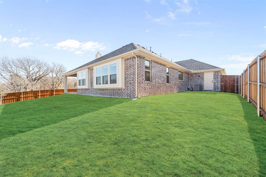 Exterior details and patio area of a home in Villages of Hurricane Creek, Anna (Image 3).