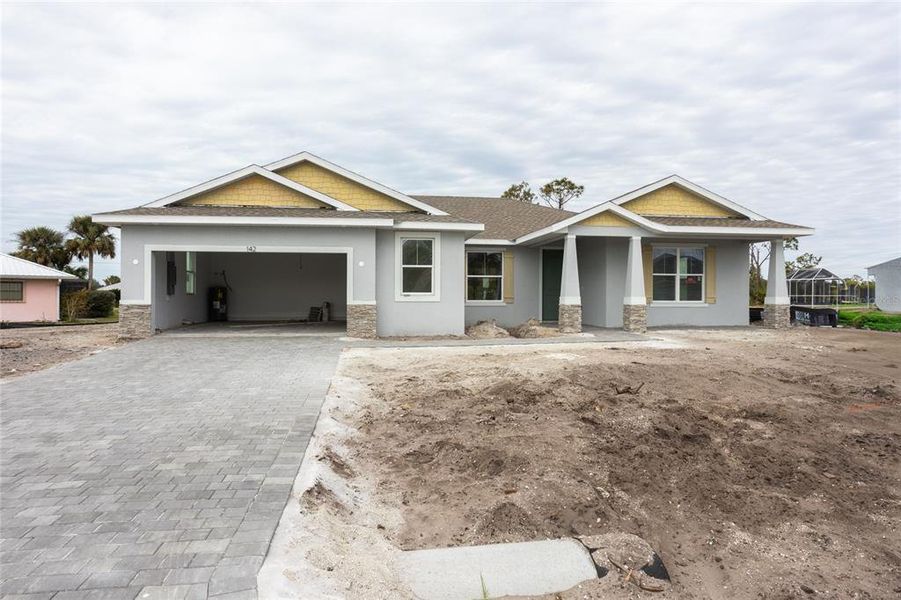 Front exterior of a new home in , Rotonda West, FL, highlighting curb appeal (Image 11).