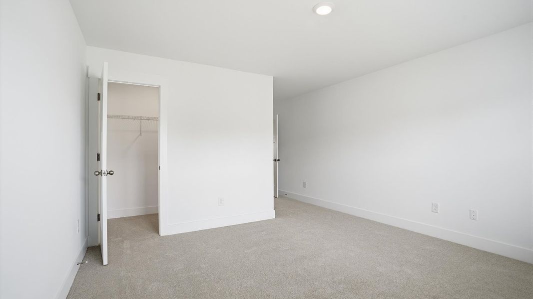 Highly functional bedroom with walk-in closet and tasteful carpet for a restful retreat in Anderson, SC Highly functional bedroom with walk-in closet and tasteful carpet for a restful retreat in Anderson, SC