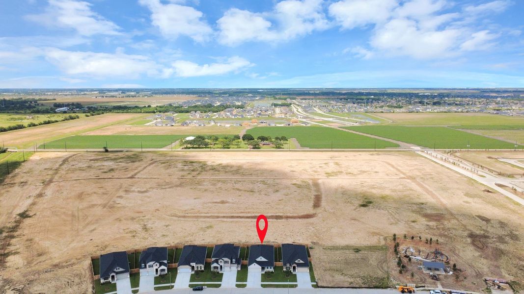 An aerial view of a spacious subdivision lot, highlighting a well-maintained yard and a fully fenced perimeter, offering both privacy and expansive outdoor space. An aerial view of a spacious subdivision lot, highlighting a well-maintained yard and a fully fenced perimeter, offering both privacy and expansive outdoor space.