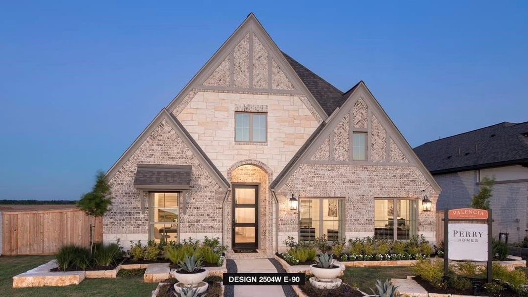 Front exterior of a new home in Valencia 50', Manvel, TX, highlighting curb appeal (Image 2). Front exterior of a new home in Valencia 50', Manvel, TX, highlighting curb appeal (Image 2).