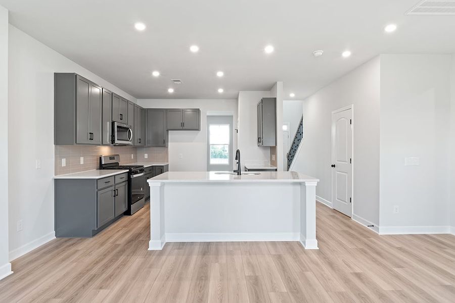 A kitchen with white cabinets. A kitchen with white cabinets.