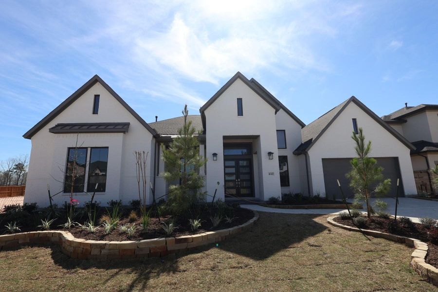 Front exterior of a new home in Woodson’s Reserve, Spring, TX, highlighting curb appeal (Image 6).