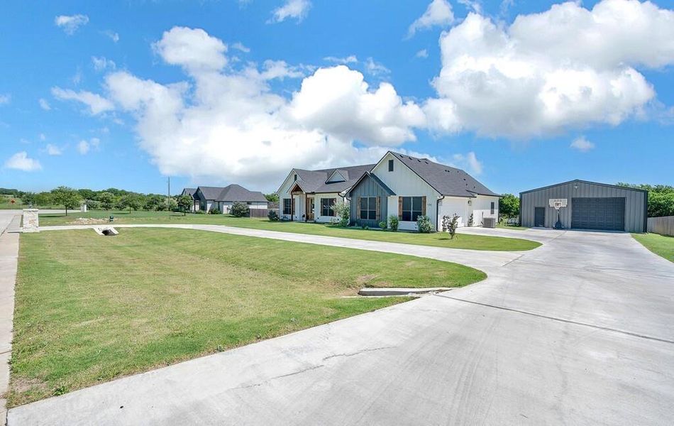 Front exterior of a new home in , Lorena, TX, highlighting curb appeal (Image 24).
