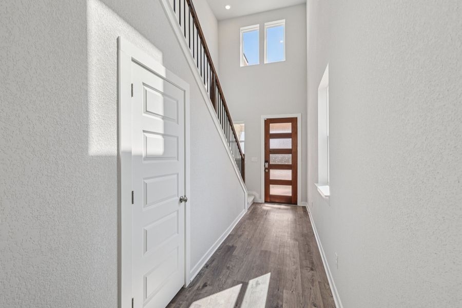 A hallway with white doors.