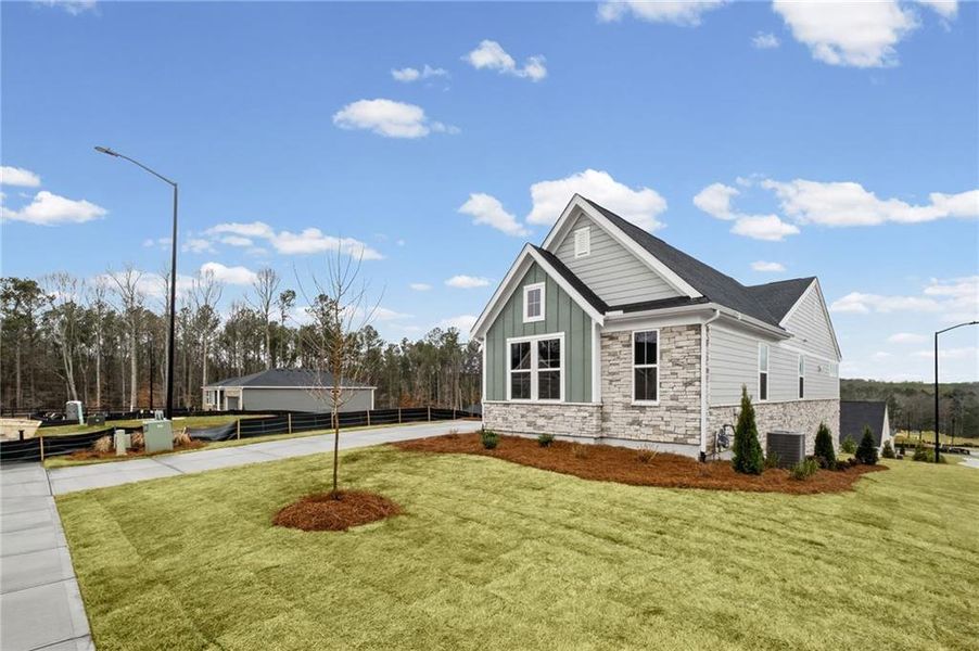 Front exterior of a new home in Easton Park, Dallas, GA, highlighting curb appeal (Image 20). Front exterior of a new home in Easton Park, Dallas, GA, highlighting curb appeal (Image 20).