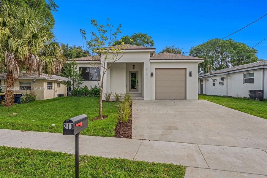 Front exterior of a new home in , Dania Beach, FL, highlighting curb appeal (Image 1). Front exterior of a new home in , Dania Beach, FL, highlighting curb appeal (Image 1).