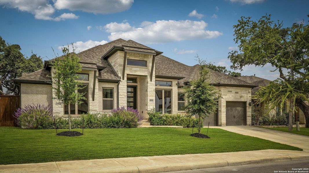 Front exterior of a new home in Balcones Creek 70', Boerne, TX, highlighting curb appeal (Image 2).
