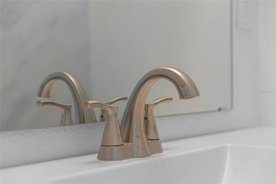 Large mirrors with nice fixtures throughout the house