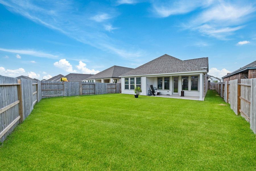 Front exterior of a new home in Marvida 45', Cypress, TX, highlighting curb appeal (Image 20). Front exterior of a new home in Marvida 45', Cypress, TX, highlighting curb appeal (Image 20).