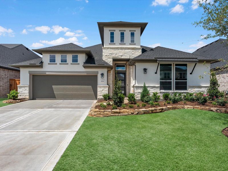 Front exterior of a new home in Pecan Ridge, Fulshear, TX, highlighting curb appeal (Image 2). Front exterior of a new home in Pecan Ridge, Fulshear, TX, highlighting curb appeal (Image 2).