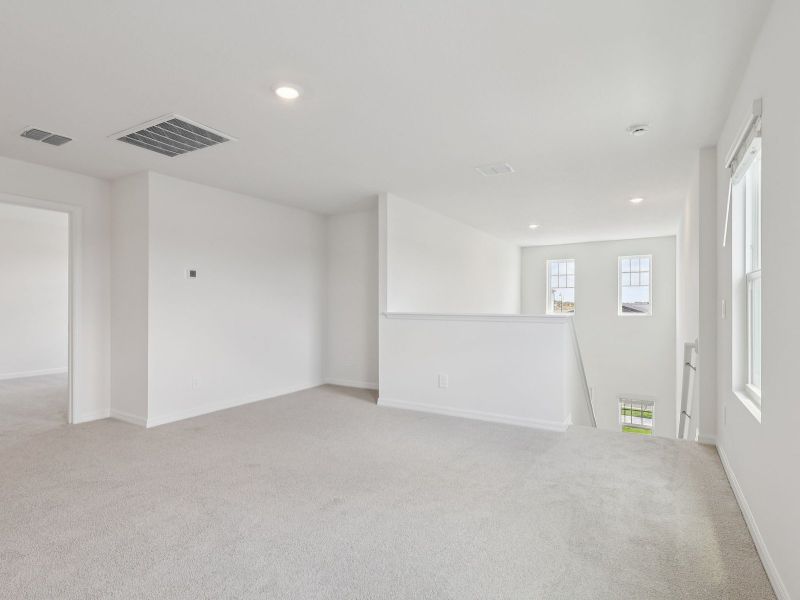 Spacious, unfurnished interior of a new home in The Reserve at Hammock Oaks - Classic Series, Lady Lake (Image 9).