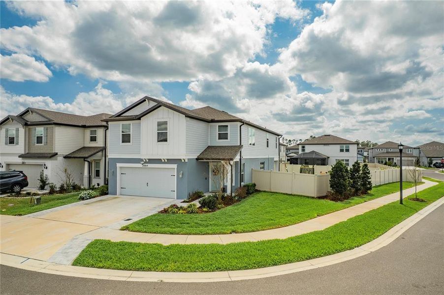 Front exterior of a new home in , Land O' Lakes, FL, highlighting curb appeal (Image 2). Front exterior of a new home in , Land O' Lakes, FL, highlighting curb appeal (Image 2).
