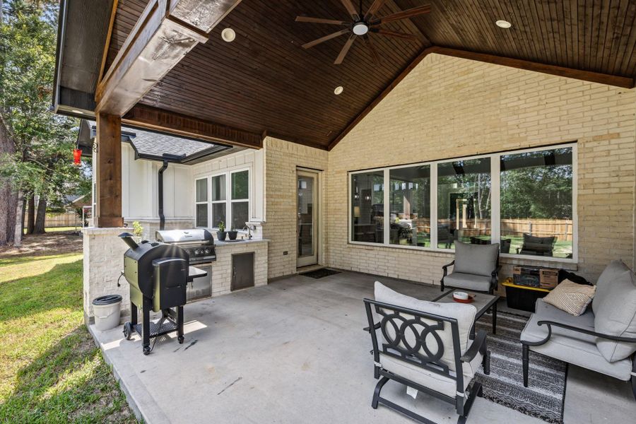 COVERED PATIO — Expansive covered patio extends the home’s living space outdoors, creating a comfortable setting for dining, relaxing, and entertaining.