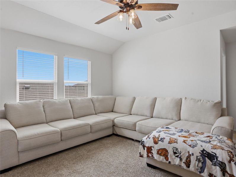 Vaulted ceilings and soft carpeting create an inviting and comfortable living space. Vaulted ceilings and soft carpeting create an inviting and comfortable living space.