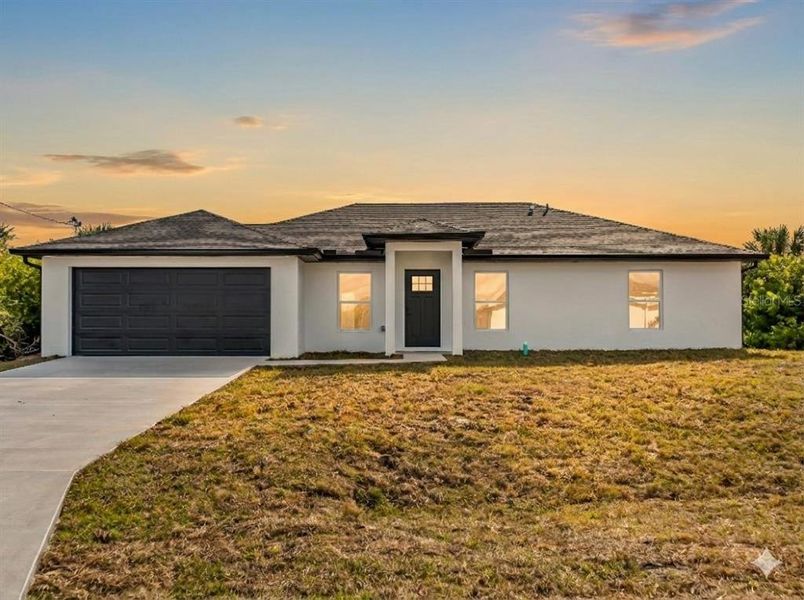 Front exterior of a new home in , Port Charlotte, FL, highlighting curb appeal (Image 32).