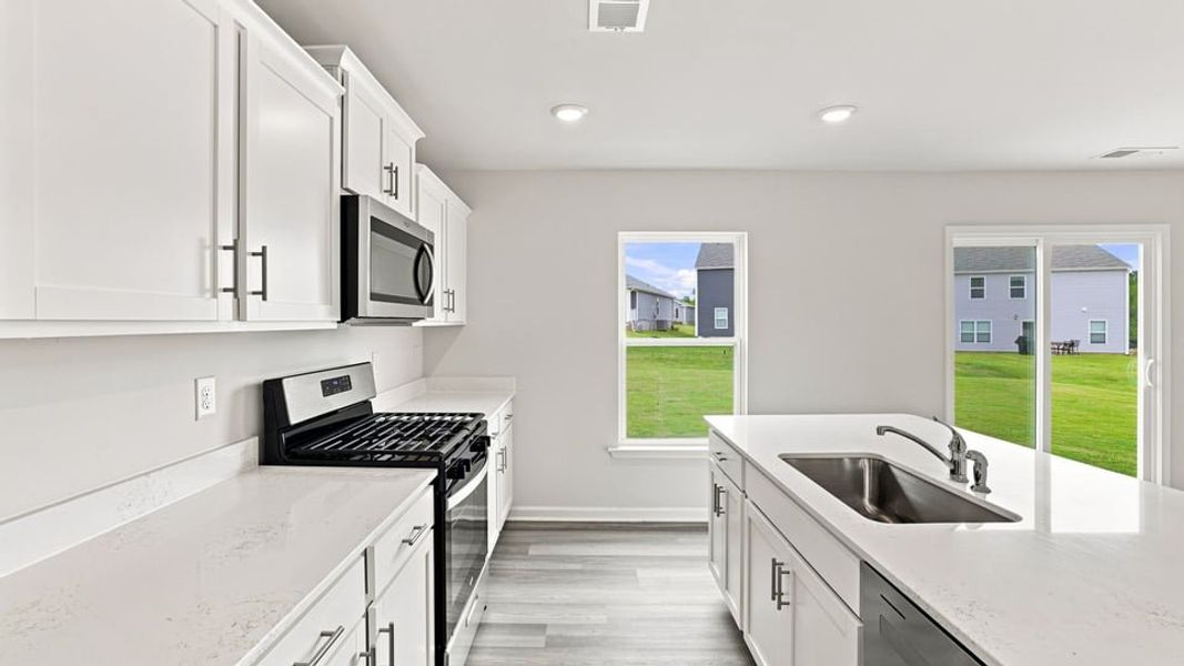 Furnished interior view inside a new home in Lakestone, Woodruff (Image 10).