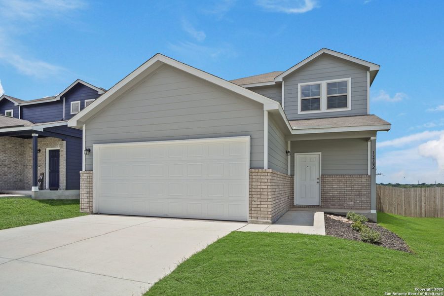 Front exterior of a new home in Cinco Lakes, San Antonio, TX, highlighting curb appeal (Image 25). Front exterior of a new home in Cinco Lakes, San Antonio, TX, highlighting curb appeal (Image 25).