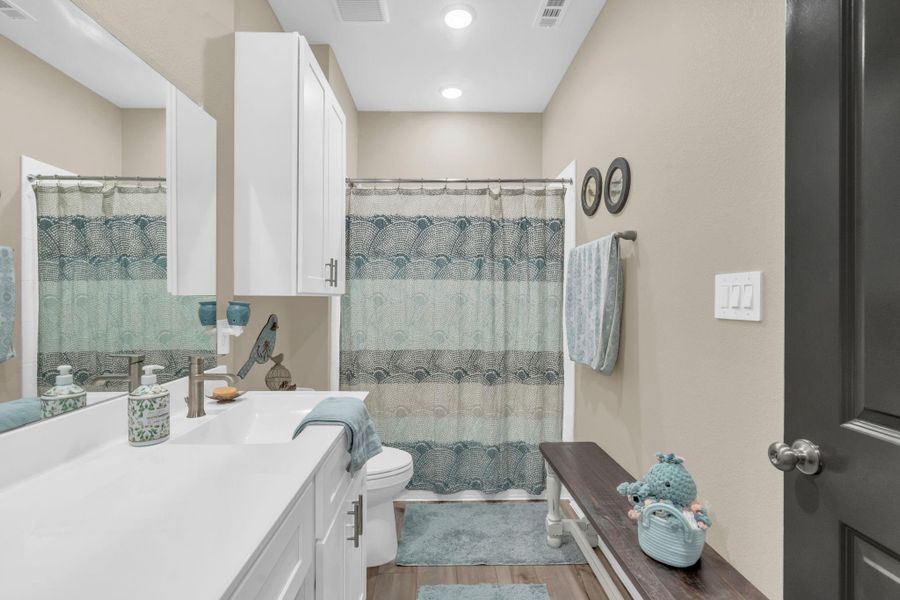 Custom cabinets over the toilet in the full bath. Custom cabinets over the toilet in the full bath.