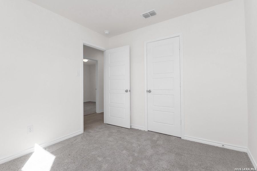 Spacious, unfurnished interior of a new home in Hidden Bluffs at TRP, San Antonio (Image 11).