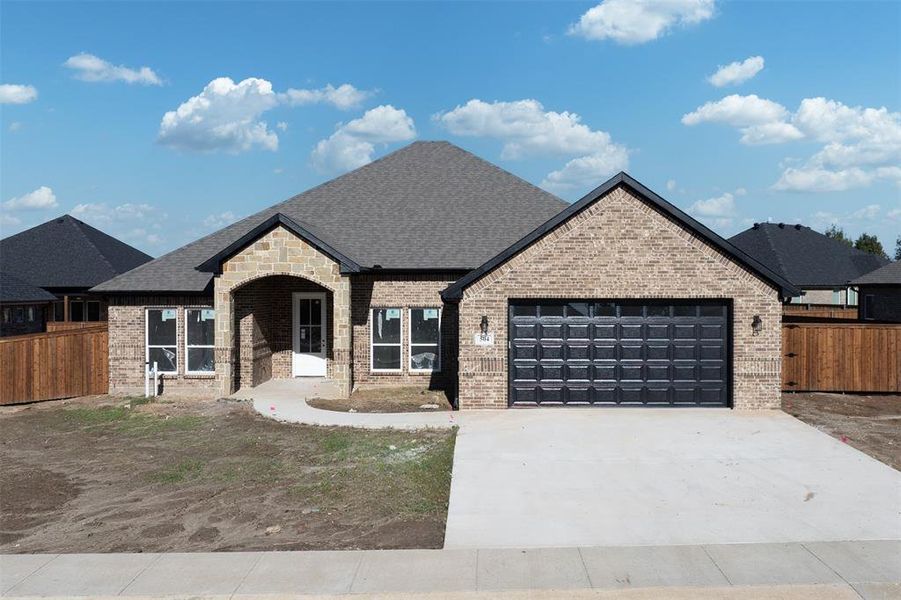 Front exterior of a new home in , Mabank, TX, highlighting curb appeal (Image 1). Front exterior of a new home in , Mabank, TX, highlighting curb appeal (Image 1).