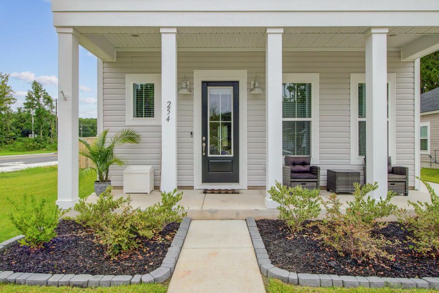 Front exterior of a new home in Limehouse Village: Row Collection, Summerville, SC, highlighting curb appeal (Image 26).